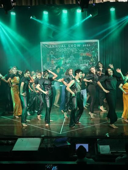 The entire IMAD team takes the stage for the final bow at "Tarulya" 2023. This moment represents the unity and passion that drives our school.