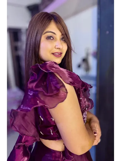 A soft and romantic take on party glam. The makeup is kept elegant and the focus is on the client's bright, happy expression.