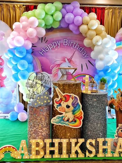 A magical unicorn-themed birthday party filled with pastel rainbow colors. This enchanting decor features unicorn cutouts, rainbow balloon arrangements, and a custom backdrop, creating a whimsical wonderland for the birthday girl.