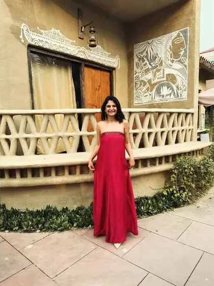 Anupriya looks beautiful in our red strapless dress. Our philosophy is to create pieces that bring a touch of elegance and sustainability to every look.