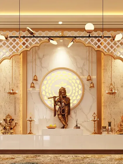 We design sacred spaces that are both divine and architecturally integrated. This expansive pooja room features an ornate marble and lattice-work backdrop, dedicated niches for idols, and intricate lighting to create a serene and powerful spiritual center in the home.