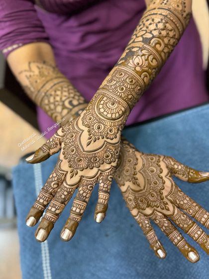 Another perspective of this elegant bridal design, showing how the patterns flow seamlessly from the palm to the forearm.