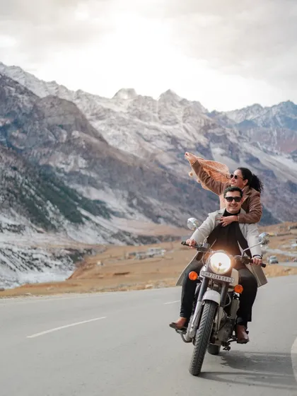 An adventurous ride through the mountain passes of Himachal. This shot is for the couple that finds romance in the journey, with the wind in their hair and epic views ahead.