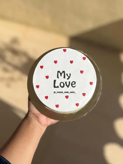 A simple "My Love" cake with red hearts, perfect for an anniversary, birthday, or just because.