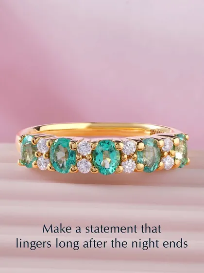 Make a statement that lingers long after the night ends. This beautiful band features alternating emeralds and diamonds, creating a captivating pattern of colour and light.