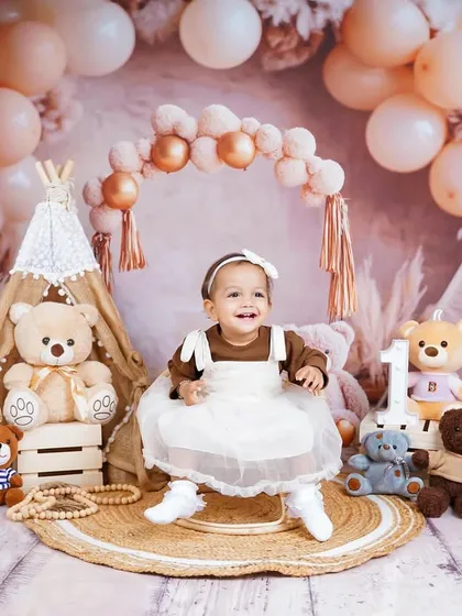 A happy, candid moment from the boho-themed shoot. The warm, earthy tones of this setup create a cozy and inviting atmosphere.