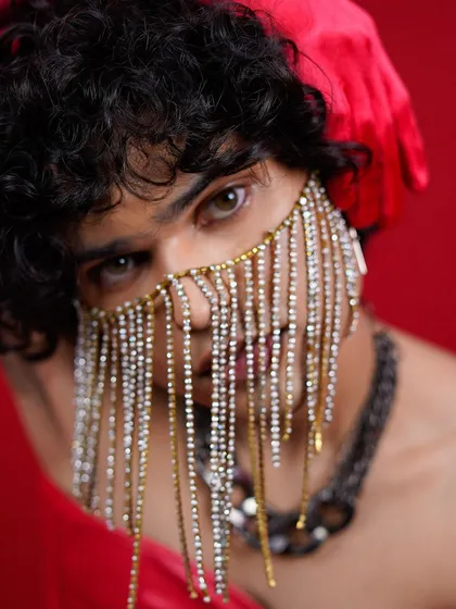 I love pushing creative boundaries with bold ideas and unique props. This editorial beauty shot uses a jeweled mask to draw attention to the eyes, creating a sense of mystery and high-fashion artistry that stands out.