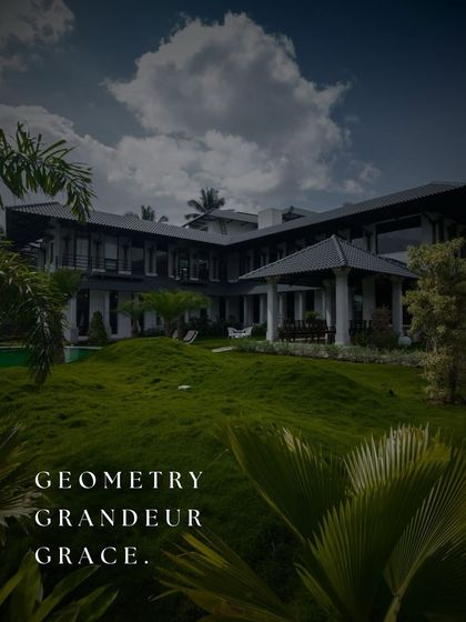 Geometry, grandeur, and grace. This expansive farmhouse is set against rolling green lawns, its strong architectural forms creating a sense of presence and timeless elegance.