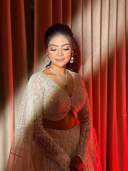 The dramatic lighting highlights the shimmer and glow of Ruchita's sangeet makeup, creating a truly magical effect.