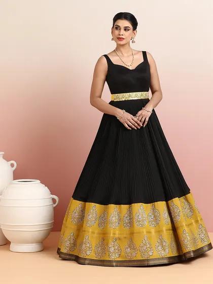 As one of our festive bestsellers, this black and gold gown is a testament to our commitment to creating timeless yet modern designs.