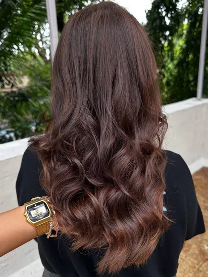This 'Cinnamon Chocolate' color is perfect for adding warmth and spice to dark hair. The cinnamon tones really pop against the deep chocolate base, especially when styled with waves.