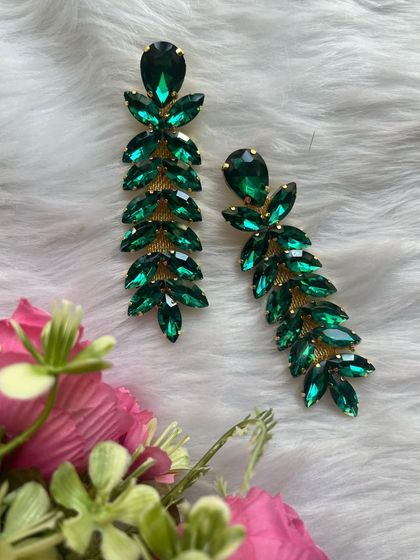 Another shot of the green crystal party wear earrings. The leaf-like arrangement of the stones is just so elegant.