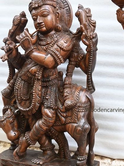 Another detail shot of the 36-inch Krishna, focusing on his serene expression and the delicate way he holds the flute.