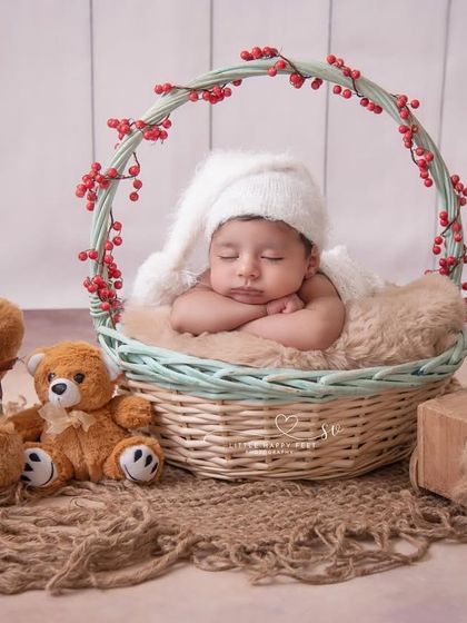 A classic teddy bear picnic. Nestled in a basket with his furry friends, this baby boy looks so peaceful and content. This is a timeless theme that never goes out of style.