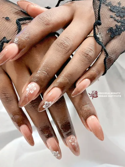 The floral and brown gradient set paired with delicate black lace gloves, enhancing the romantic and sophisticated feel of the design.