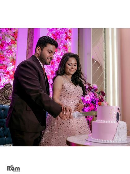 The cake cutting ceremony is always a sweet moment to capture. This photo shows the couple working together, symbolizing the start of their shared life.