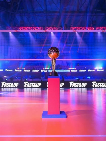 The Prime Volleyball League trophy stands proudly on the court before a match. We manage the entire on-court presentation, including lighting and branding, to create a professional and exciting atmosphere.