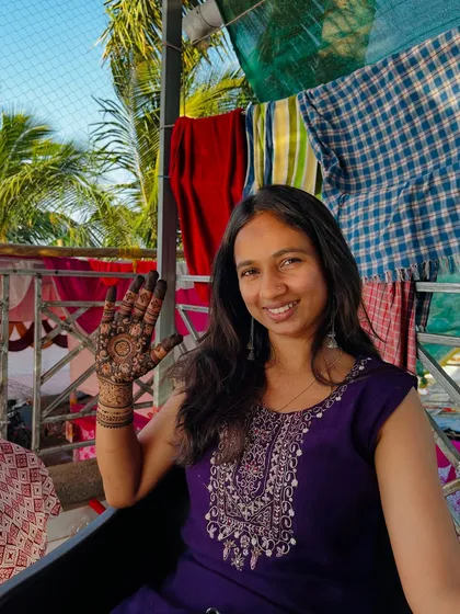A happy wave with my mehendi-adorned hand.