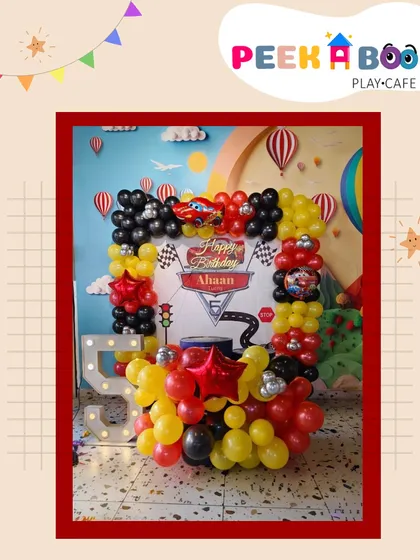 A zoom-tastic setup for Ahaan's car-themed party. The balloon photo frame, complete with a "Cars" backdrop and a light-up number '5', was a huge hit.