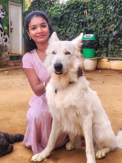 Posing with a beautiful white German Shepherd, another one of our stunning resident dogs.