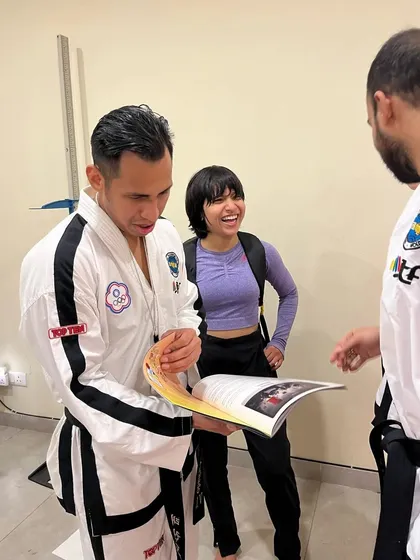 Another angle of me sharing the magazine, with a student looking on. These interactions are what make the martial arts community special.
