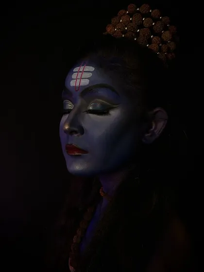 A meditative pose of the Lord Shiva makeup, highlighting the tripundra on the forehead and the calm expression.