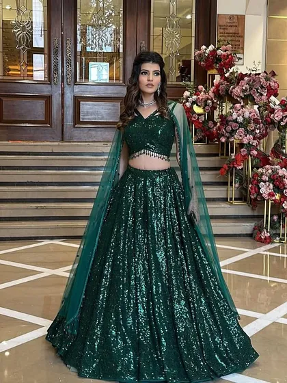 A full shot of the emerald green sequined lehenga. This is a perfect statement outfit for a reception or sangeet night.