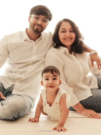 The whole family together, with the baby crawling and smiling. These dynamic shots are full of life.
