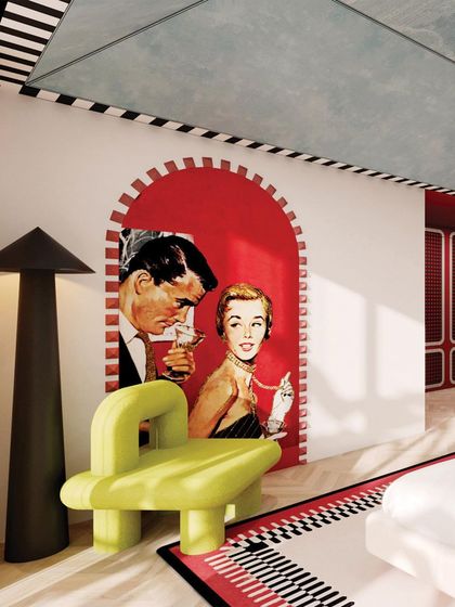 The playful pop-art mural is framed by a red arch, creating a fun and graphic feature wall.