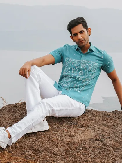 A full view of our 'Panther Prowess' shirt, with its modern, hand-embroidered motifs on sustainable kala cotton from Kutch. A perfect example of nature-inspired fashion.