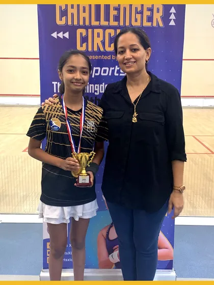 Capturing the joy of victory. A young player holds her trophy from the Challenger Circuit 2023.