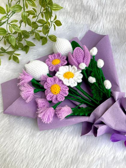 I made this pretty purple bouquet for my little sister's birthday. It has tulips, daisies, and other lovely purple flowers. It makes me so happy to know she has a bouquet from me that will never fade.