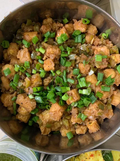 A bowl of my popular Babycorn Manchurian, crispy and tossed in a savory sauce.