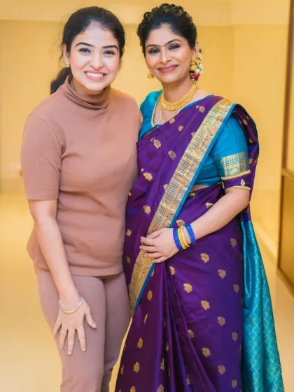 This is me with Keerthana at her baby's naming ceremony. It's amazing how clients become friends. For this event, we went with a soft look, nude lips, and a messy bun.