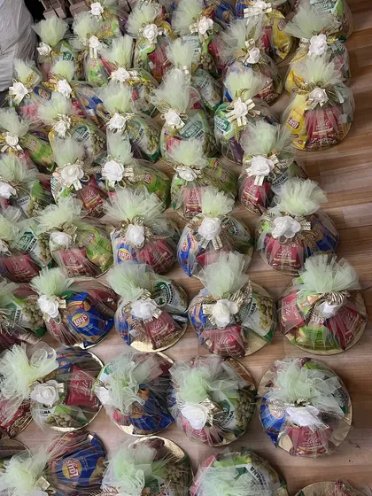 An overhead view of our wedding room hampers, all wrapped and ready to go. We can customize the contents and decoration to match your wedding theme.