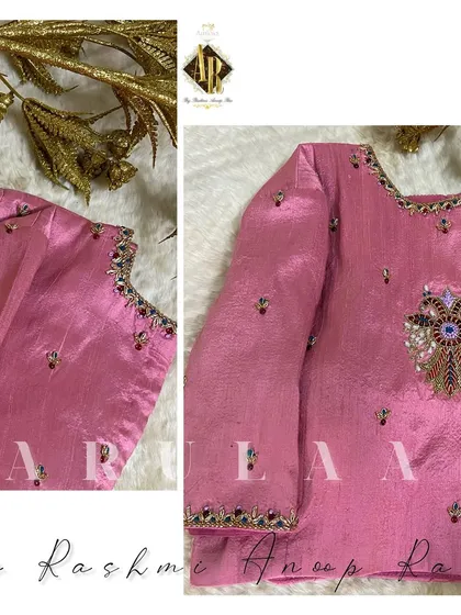 A pink blouse with a delicate evil eye motif embroidered on the back. It's a modern and personal touch for a traditional outfit.