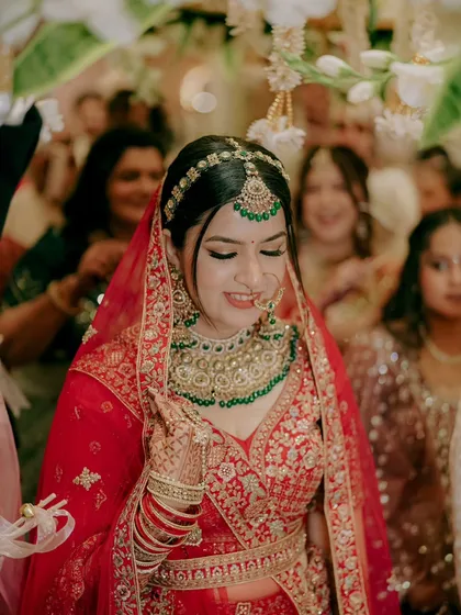 The bride's joyful smile as she walks down the aisle, surrounded by her family and friends. A moment of pure happiness and anticipation.