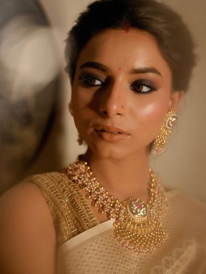 An editorial shot from my portfolio. The lighting, mood, and intense smokey eye create a powerful and artistic image.