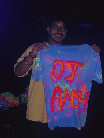 The theme for this Holi party was neon. I even got a custom-painted shirt to match the glow-in-the-dark fun.