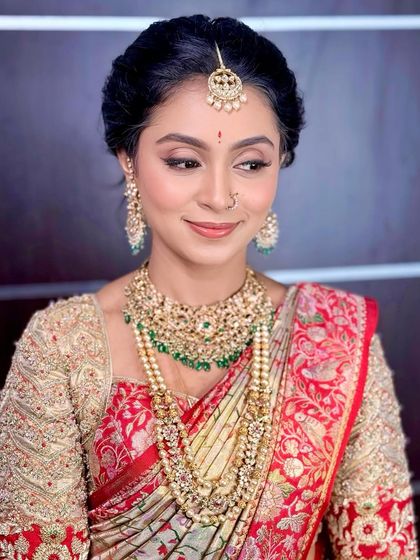 A beautiful side profile, highlighting the delicate features and the intricate details of the jewellery.