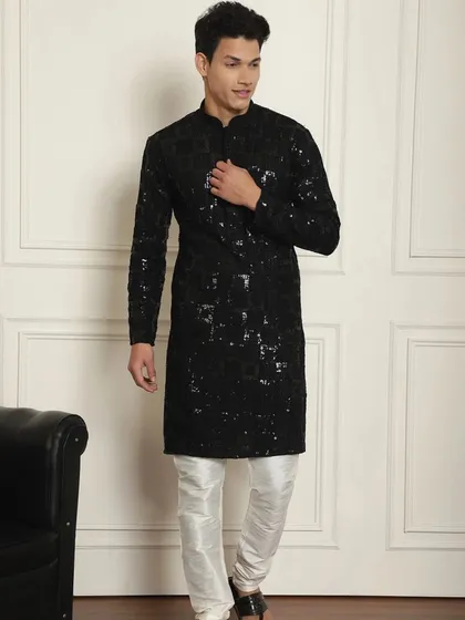 Ready to dazzle this Diwali? This black sequined kurta pajama is crafted to make every moment unforgettable. Step into the festivities in style.
