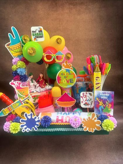 When everything is brimming with the joy and colors of Holi, our hampers are too! This fun arrangement is packed with balloons, water guns, colors, and treats to ensure a happy and playful celebration.