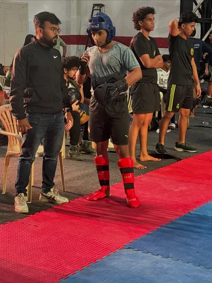 Final words of advice from the coach before stepping onto the mat. Mental preparation is just as important as physical training.