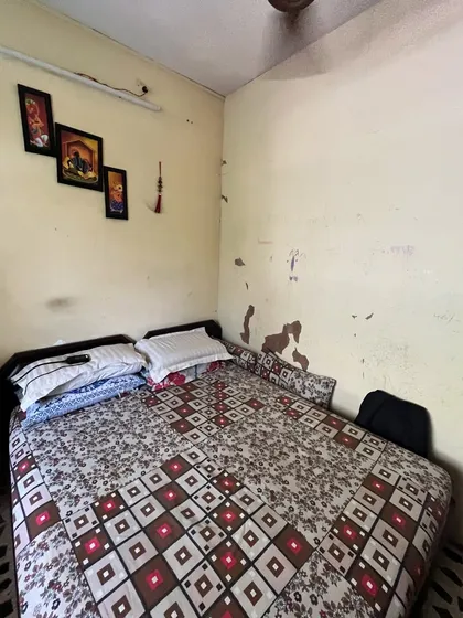 The kids' room in the Vora House before we began. It was a cramped space with peeling paint and dated furniture, in need of a complete overhaul.