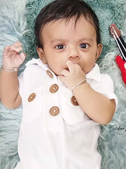 Music is life. This little boy looks thoughtful and curious during his music-themed milestone session.