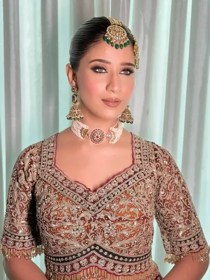 A stunning "Marwar" inspired bridal look. I curated this for a makeup artist's portfolio, focusing on traditional jewelry and rich, earthy tones.