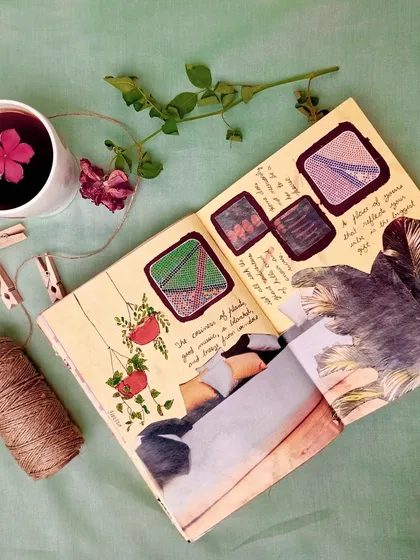 A cozy, plant-themed journal page styled with a cup of tea and dried flowers.