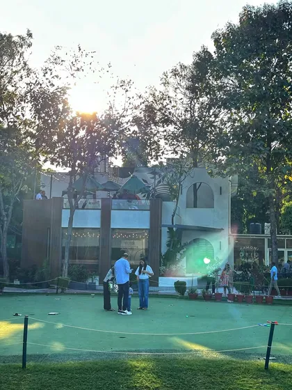 The putting green is a popular spot for both serious practice and casual fun with friends.
