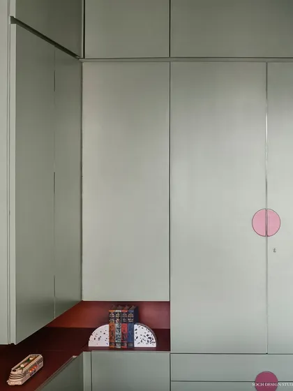 Detail of the kids' wardrobe, featuring a built-in niche for displaying toys and treasures.