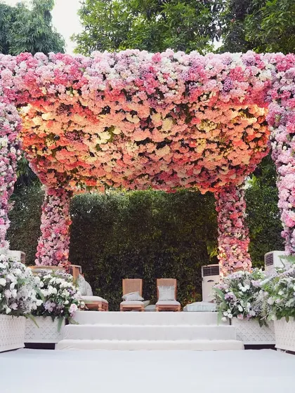 A floral mandap is the heart of a wedding, and we designed this one to be a true masterpiece. Covered in thousands of fresh pink and ivory roses, it creates a stunning, fragrant sanctuary for the couple to exchange their vows, embodying romance and natural beauty.